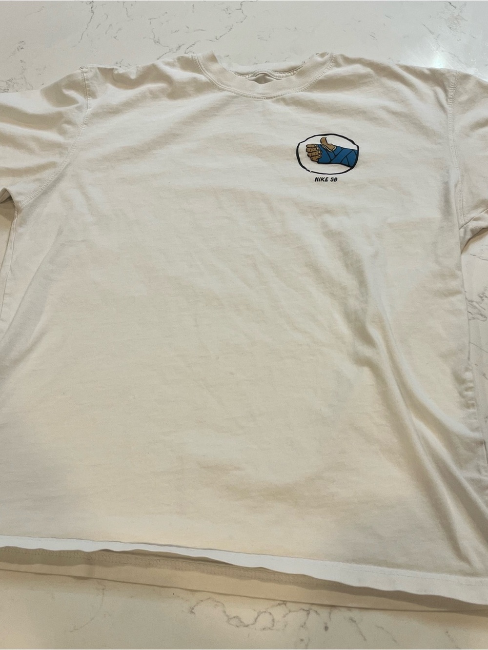Nike White Short-Sleeve Tee with Small Blue Graphic